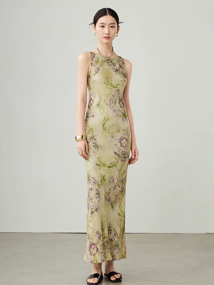 Side angle of women's floral sleeveless maxi dress in cupro blend fabric.