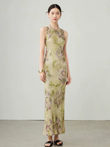 Side angle of women's floral sleeveless maxi dress in cupro blend fabric.