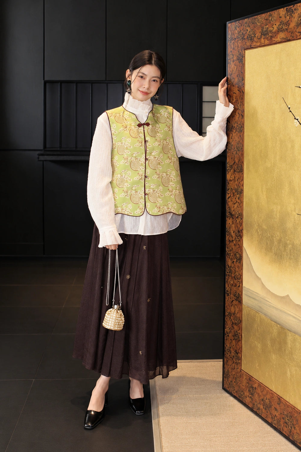 Full-length outfit featuring the green silk vest, white blouse and dark brown skirt