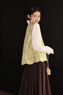 Side and back view of the green floral Song brocade silk vest