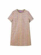 Flat lay of a cream 100% mulberry silk dress with purple and blue geometric heritage print