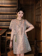 Model wearing a cream pure silk new Chinese dress with a colorful geometric print and short sleeves