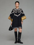 Model wearing a heritage-inspired navy silk tunic dress with round neckline and embroidered wide sleeves