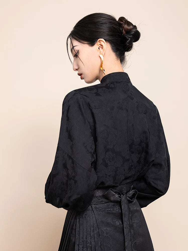 Back view of the Ink Black Jacquard Mandarin Collar Blouse with tie detail.