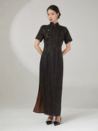 Front view of an ink black mulberry silk cheongsam dress featuring a tailored silhouette and traditional frog button closure.