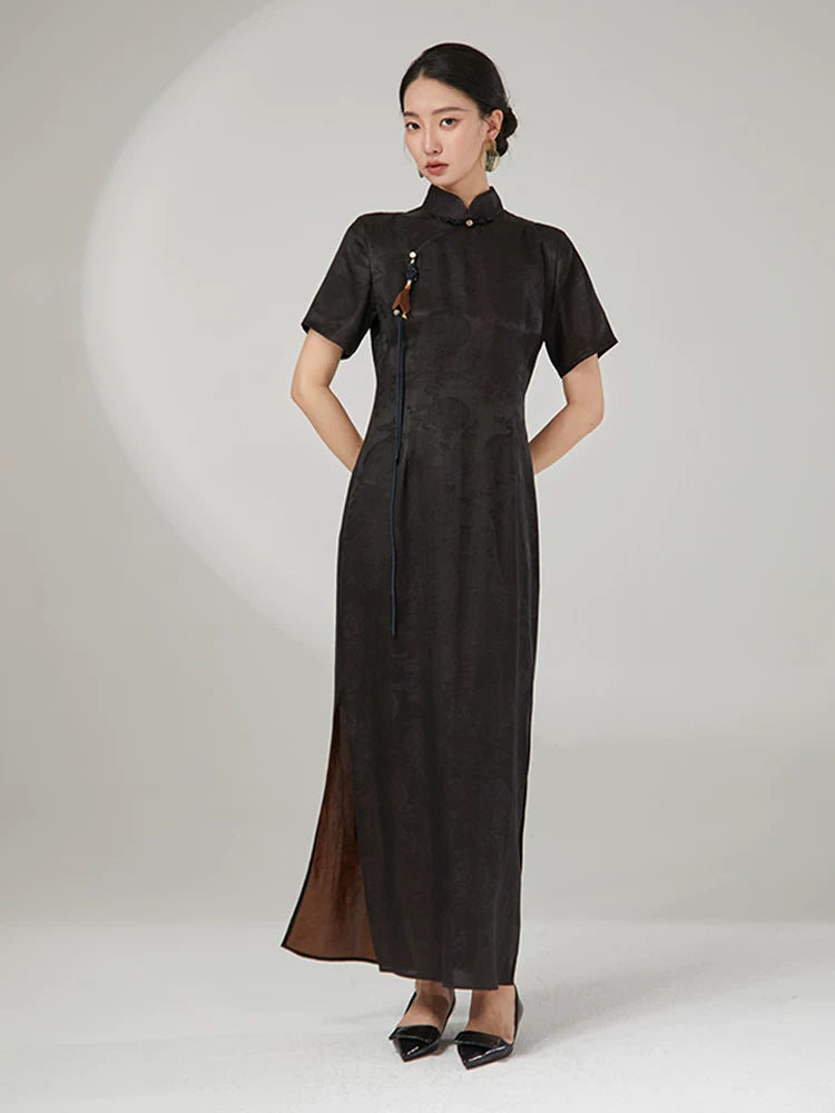 Front view of an ink black mulberry silk cheongsam dress featuring a tailored silhouette and traditional frog button closure.