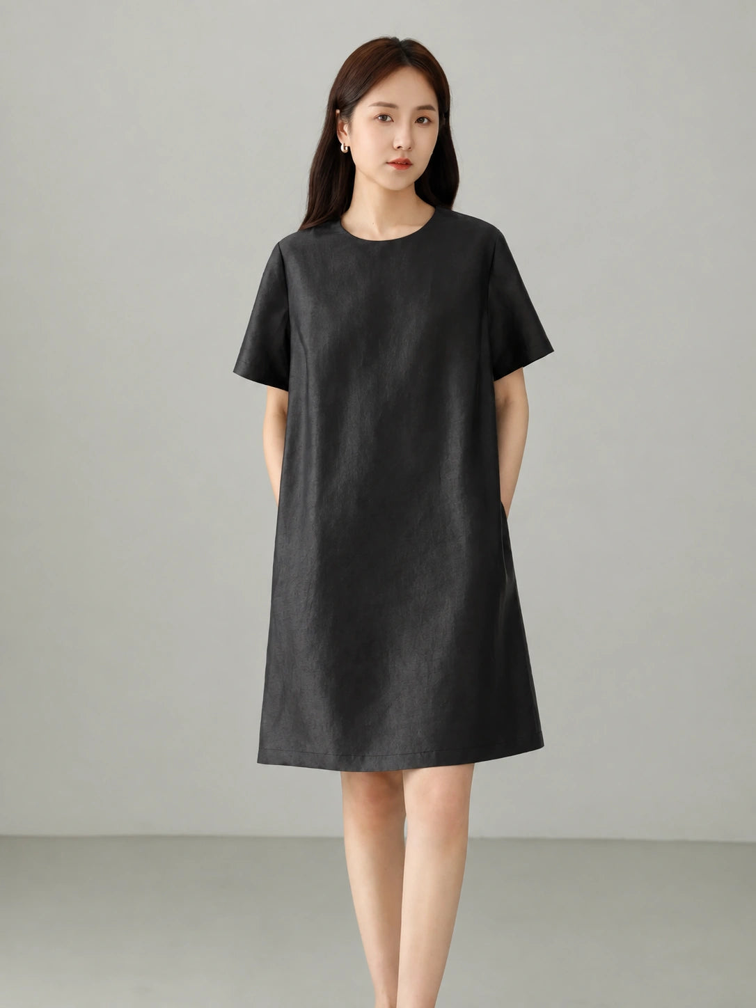 Ink black Xiangyunsha mulberry silk dress with minimalist round neckline and elegant relaxed silhouette, front view