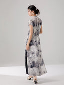 Back view of the ink print layered cheongsam dress with flowing silhouette.