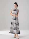 Elegant ink print maxi dress featuring a layered design and cap sleeves.