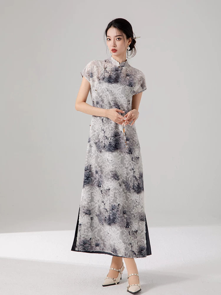 Elegant ink print maxi dress featuring a layered design and cap sleeves.