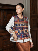 Model wearing the Inkstone Blue embroidered vest over a white blouse