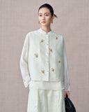 Three-quarter view of the champagne beige vest with butterfly embroidery