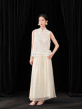 Front view of an ivory Chinese-style A-line skirt paired with a delicate embroidered organza top.
