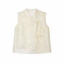 Flat lay of an ivory sleeveless embroidered vest with a mandarin collar, floral embroidery, and side tie details.