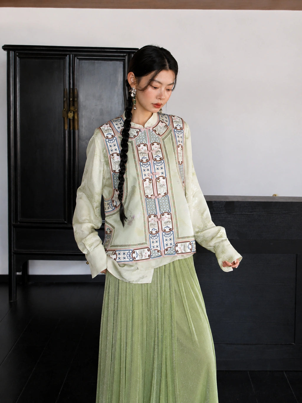 Front view of an ivory floral mulberry silk vest featuring a stand collar and traditional decorative trim.