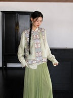 Front view of an ivory floral mulberry silk vest featuring a stand collar and traditional decorative trim.