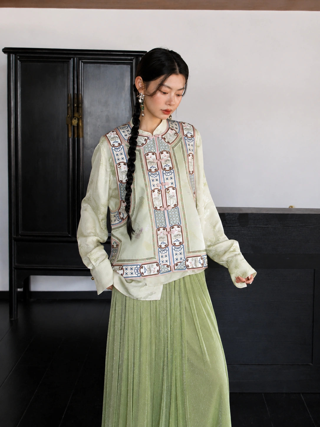 Front view of an ivory floral mulberry silk vest featuring a stand collar and traditional decorative trim.