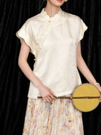 Close-up of the ivory mulberry silk qipao collar top with delicate bead embroidery and jacquard texture
