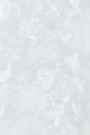 Close-up of the ivory fabric with subtle butterfly and floral jacquard motifs.