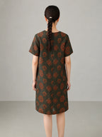 Back view of jade lotus pattern Xiangyunsha mulberry silk dress featuring traditional floral motifs and elegant straight silhouette.