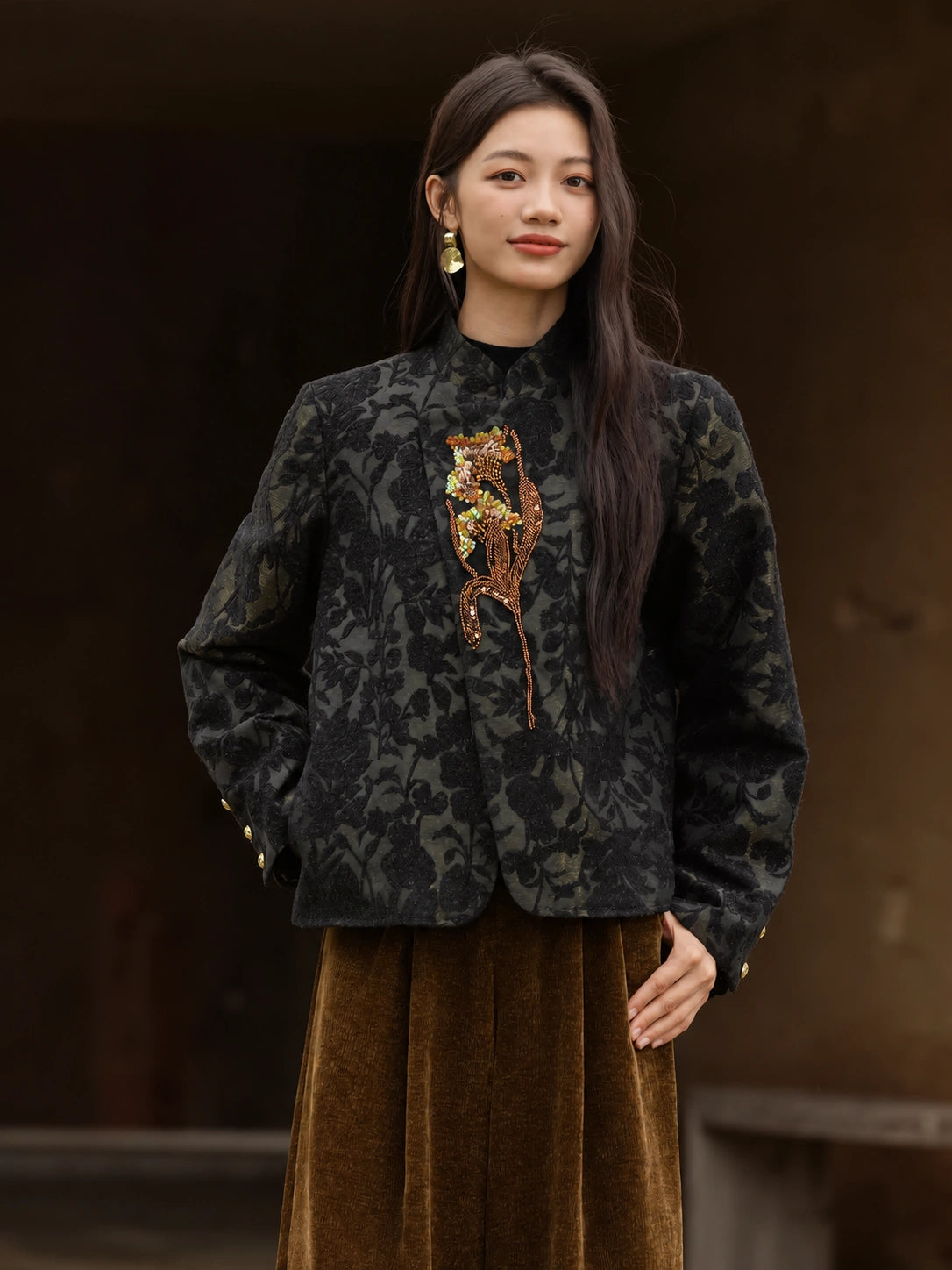 Front view of the Jianwu dark floral jacquard jacket with a stand collar and gold-tone embroidered floral appliqué