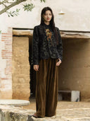 Jianwu short jacquard jacket styled with brown wide-leg trousers outdoors