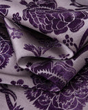 Close-up of the deep purple floral pattern on lavender fabric