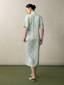 Back view of a light blue jacquard Chinese style midi dress
