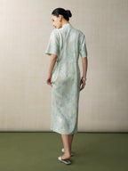 Back view of a light blue jacquard Chinese style midi dress