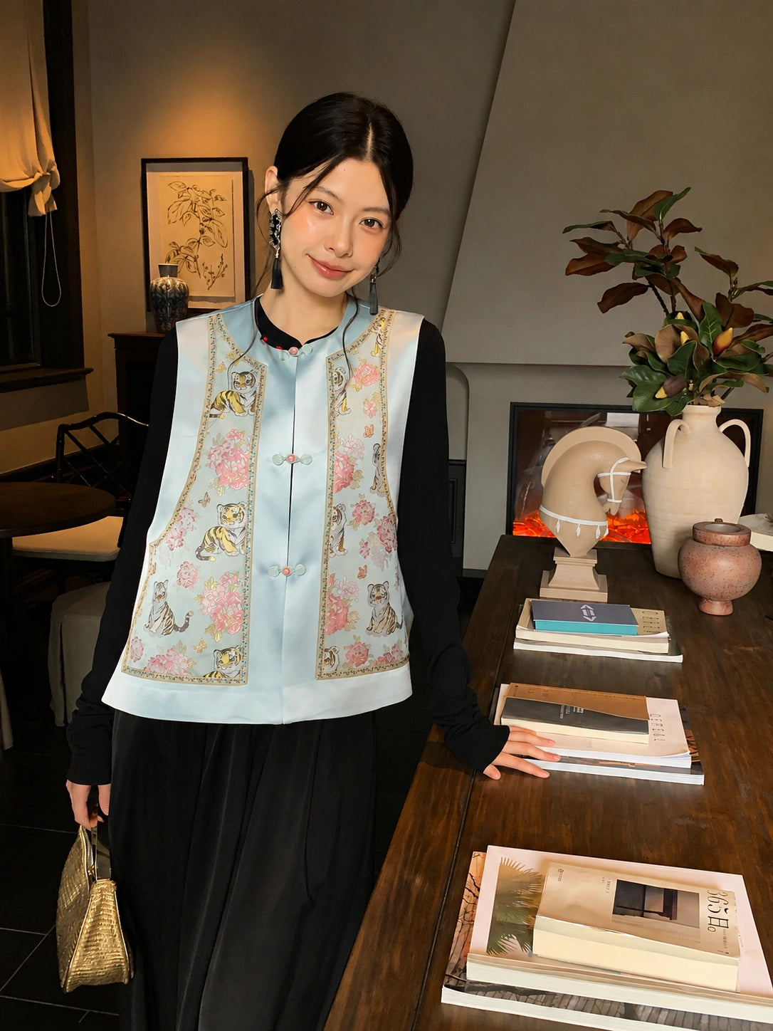 Front view of a light blue mulberry silk Chinese vest with round neckline, floral pattern, and decorative front buttons.
