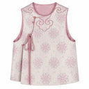 Front product view of the pink sleeveless vest with floral jacquard, an asymmetric opening and side tie.