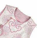 Close-up of the pink-lined round neckline and ruyi-inspired embroidery on the vest.