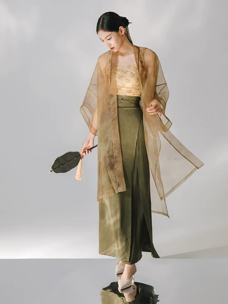Lightweight sheer organza outer layer styled with a long satin skirt.
