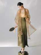 Lightweight sheer organza outer layer styled with a long satin skirt.
