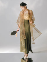 Lightweight sheer organza outer layer styled with a long satin skirt.