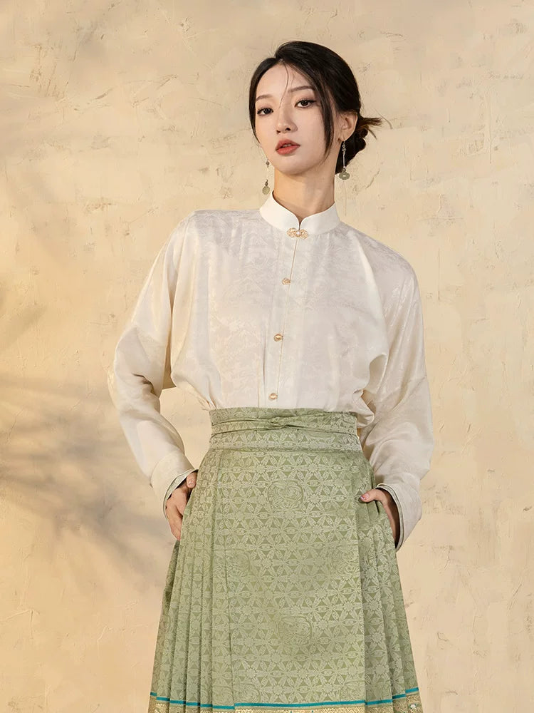 Front view of a Chinese-style jacquard blouse with relaxed fit and Mandarin collar.