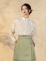 Front view of a Chinese-style jacquard blouse with relaxed fit and Mandarin collar.