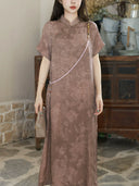 Close-up of the mauve silk-blend dress showing the stand collar and tone-on-tone floral texture