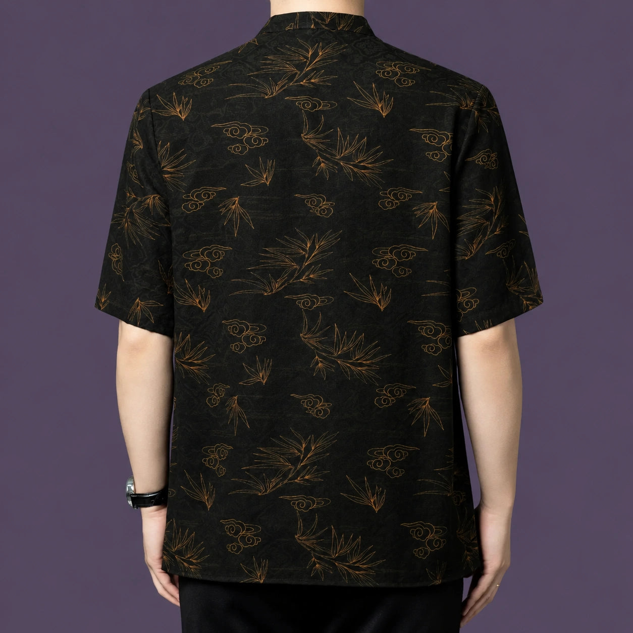 Back view of the bamboo and cloud patterned silk shirt, demonstrating the continuous, flowing motif across the entire garment.