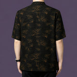 Back view of the bamboo and cloud patterned silk shirt, demonstrating the continuous, flowing motif across the entire garment.