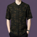 Men's black 100% mulberry silk short-sleeve shirt featuring a traditional mandarin collar, frog button placket, and copper-gold bamboo and cloud pattern.