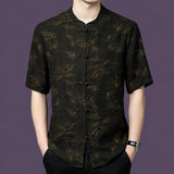 Men's black 100% mulberry silk short-sleeve shirt featuring a traditional mandarin collar, frog button placket, and copper-gold bamboo and cloud pattern.