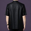 Back view of the men's black silk shirt showcasing the consistent, deeply textured crackle finish that runs across the entire garment.