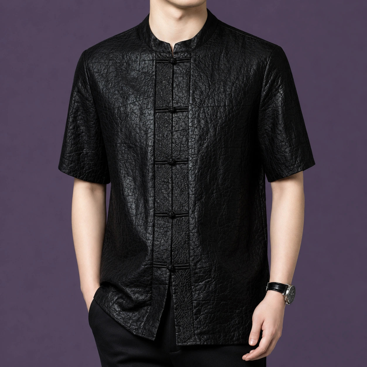 Men's black 100% mulberry silk short-sleeve shirt with a distinctive crackle leather-like texture, a stand collar, and traditional frog buttons.