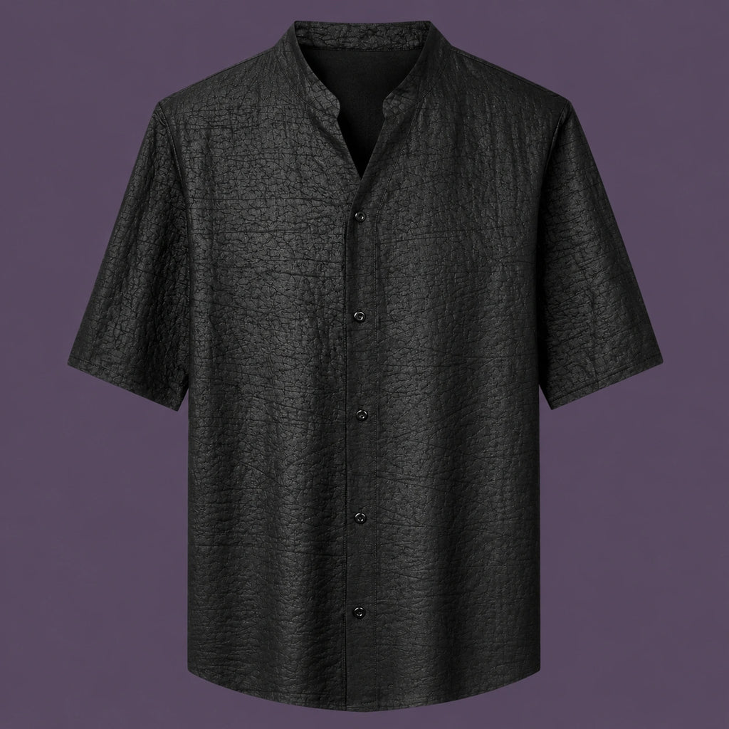 Flat lay of the men's black silk short-sleeve shirt, featuring a stand collar with a V-slit and a clean button-down front.