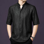 Men's black 100% mulberry silk short-sleeve shirt with a relaxed fit, a stand collar with a subtle V-opening, and a classic button placket.