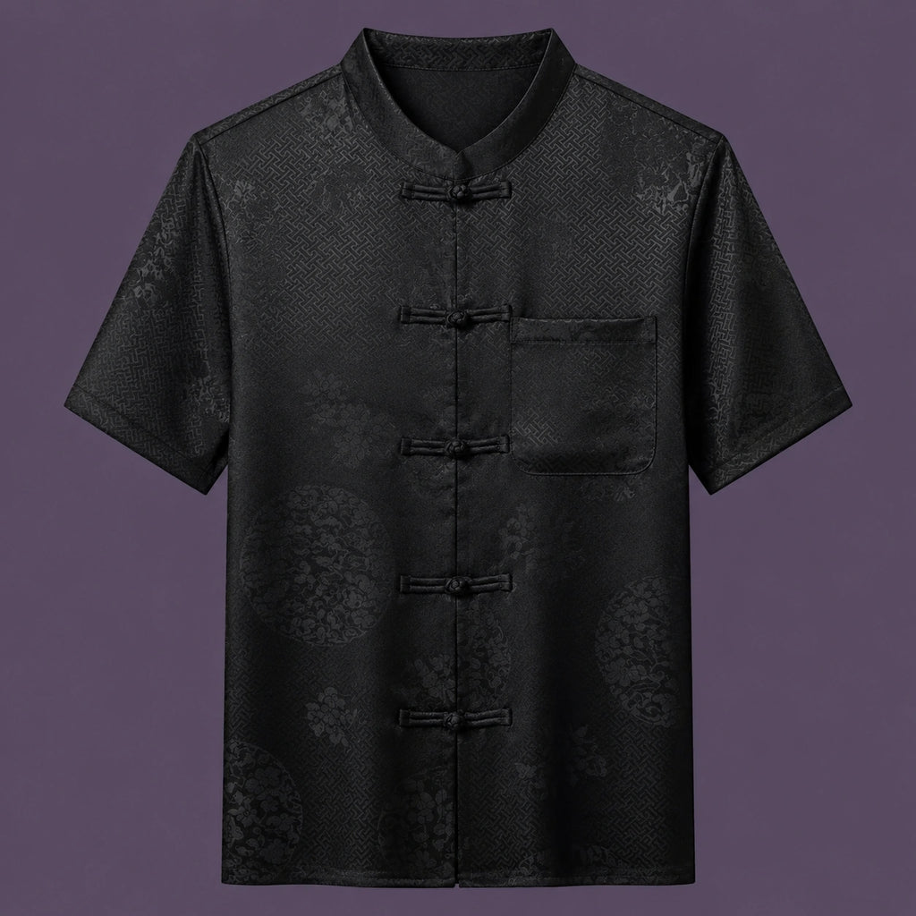 Flat lay of the men's short-sleeve silk shirt, featuring a stand collar, six frog buttons, and a single patch pocket.