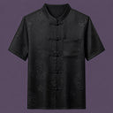 Flat lay of the men's short-sleeve silk shirt, featuring a stand collar, six frog buttons, and a single patch pocket.