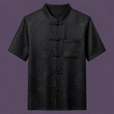 Flat lay of the men's short-sleeve silk shirt, featuring a stand collar, six frog buttons, and a single patch pocket.