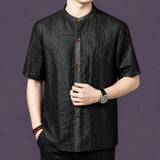 Front view of a black textured silk shirt with a clean button-down placket and a relaxed straight cut.